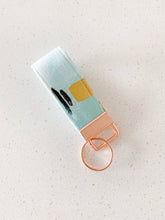 Load image into Gallery viewer, treats & the city key fob